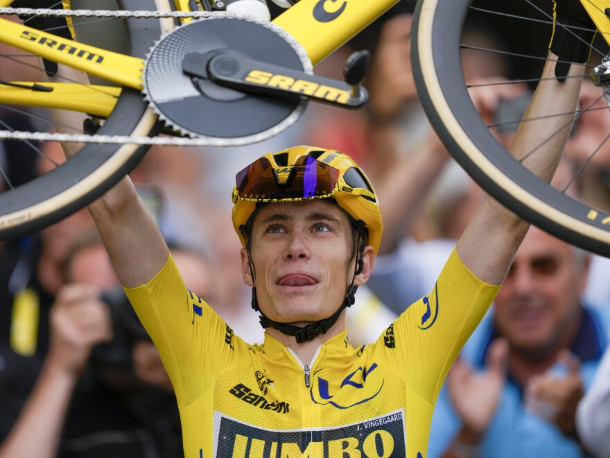 Tour de France winner Jonas Vingegaard, wearing the overall leader's yellow jersey, celebrates after the twenty-first stage of the Tour de France in Paris on Sunday.