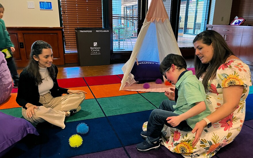 Georgette Kores sings a song to her son, Benjamin, 8, in a sensory room at the Broward Center for the Performing Arts in Fort Lauderdale on Saturday, Dec. 6, 2025.