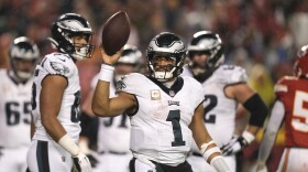 Philadelphia Eagles quarterback Jalen Hurts celebrates after scoring on a 1-yard run during the second half of an NFL football game against the Kansas City Chiefs, Monday, Nov. 20, 2023, in Kansas City, Mo. (AP Photo/Charlie Riedel)