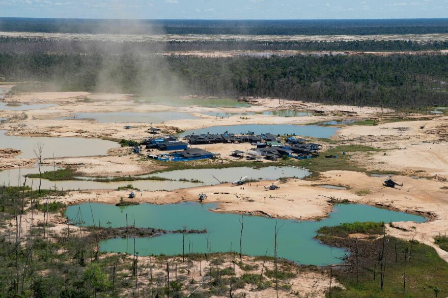 An aerial view of a deforested area of the Amazon jungle caused by illegal mining activities in the river basin of the Madre de Dios region in southeast Peru, from May 2019.