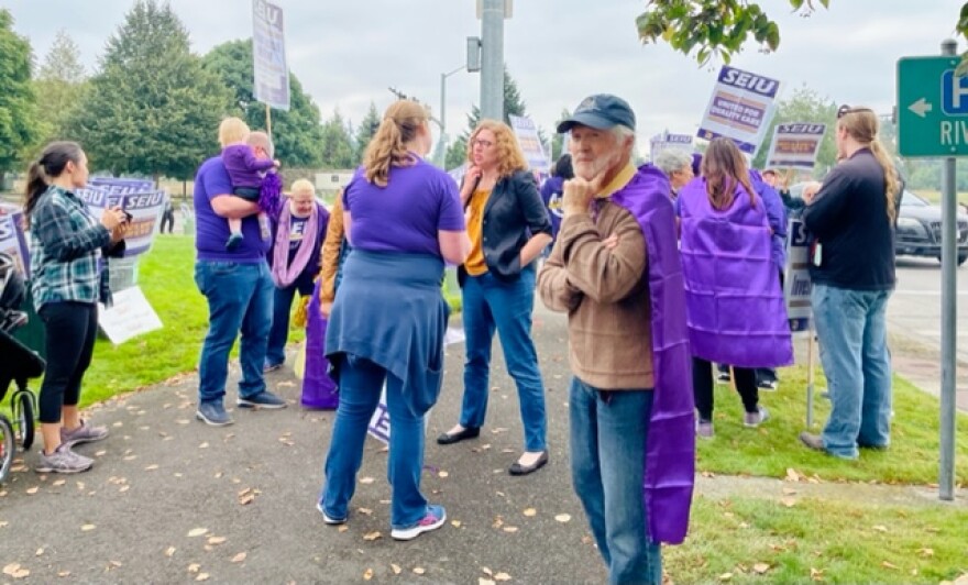 Oregon House Representatives John Lively (foreground) and Julie Fahey (center) were two of many healthcare union advocates to show up in support of the picketing hospital workers.