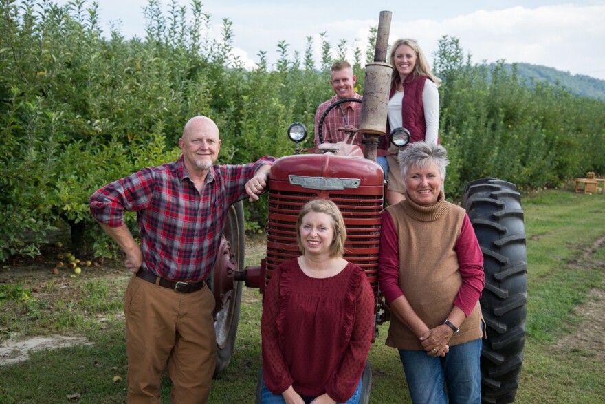 The Creasman family posed with a tractor on Creasman farms