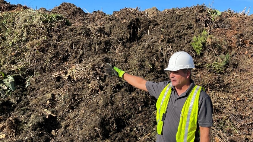 Adam Brent, CEO/Founder of Cocoa Corp., shows Laketown Township officials the pile of yard waste at the site, 4368 60th St., on Oct. 2, 2025.
