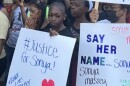 Donna Massey,  the mother of the Springfield woman who died in a shooting by a sheriff's office, holds her hands to her face during a Friday morning rally.