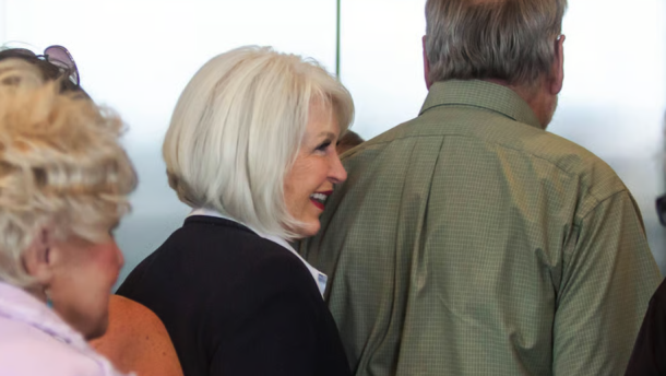 Tina Peters waits for an elevator at the Mesa County Justice Center following closing arguments on the final day of her criminal trial. The former Mesa County clerk was found guilty on 7 of 10 charges.