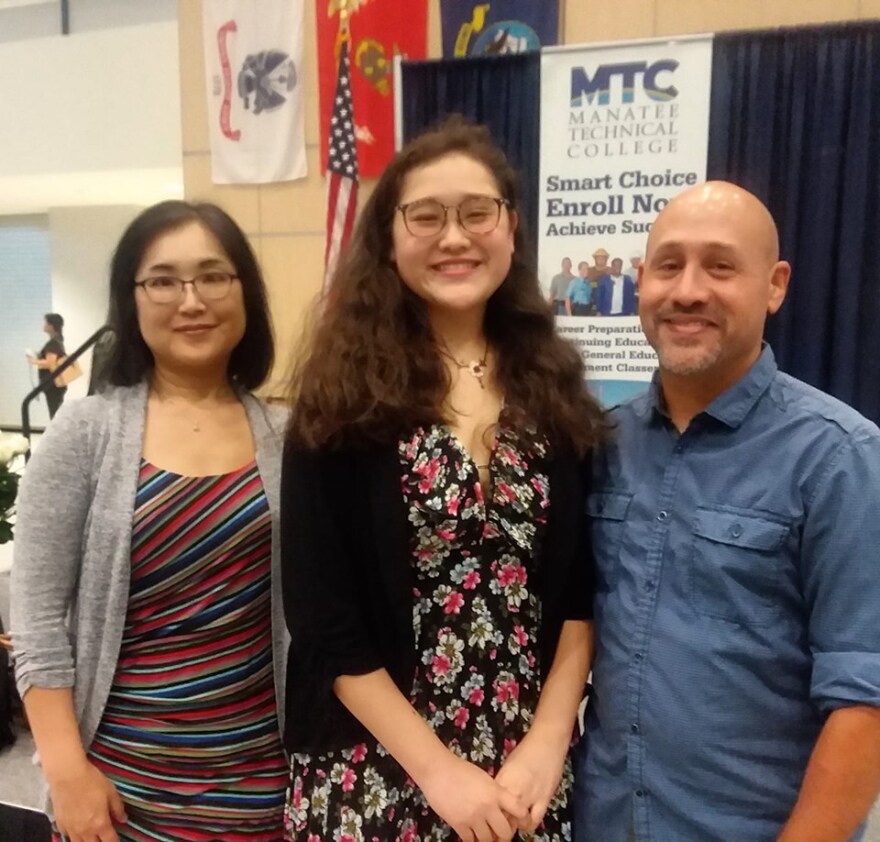 Mina Quesen, with her parents, calls her experience with the Future Leaders Academy "life changing."  She heads to Princeton this fall.