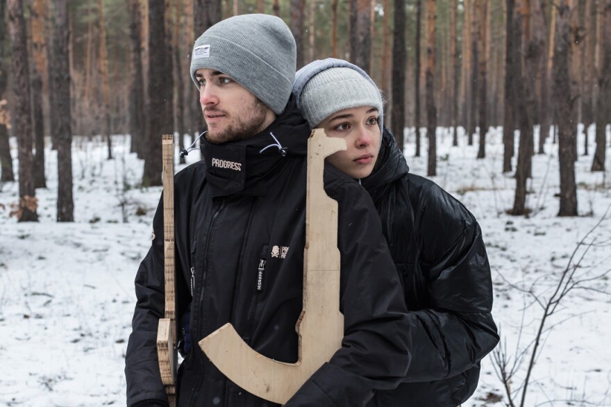 A couple Sofia Chygyryn, 19, and Vadym Beilakh, 19, pose for a portrait during the territorial defense training in Kyiv, Ukraine on February 5, 2022. Sofia, student in business psychology, and Vadym, student in management, both also work on the side, came to the training for the first time in order to prepare while the situation is still peaceful. They said “Prepare for the worse, believe in the best”.
