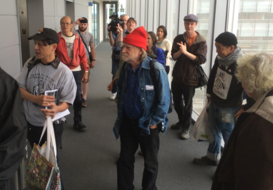 Homeless advocates gather outside Seattle Mayor Ed Murray's office.