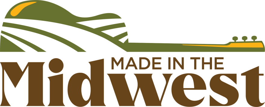 The logo for the Made in the Midwest concert series shows half on an acoustic guitar over the series' name.