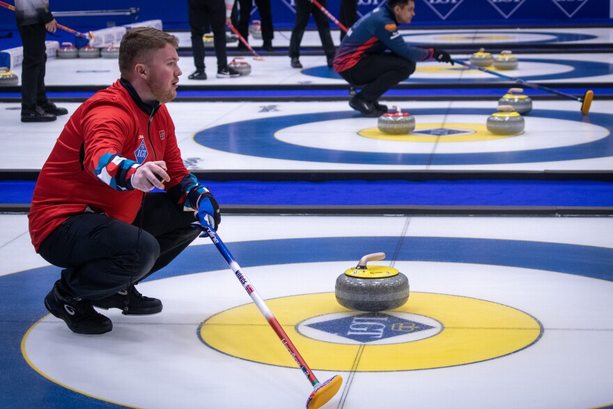Andreas Hårstad, skip of the Norwegian team, gestures to his teammates at the World Curling Championships in Ogden, March 27, 2026