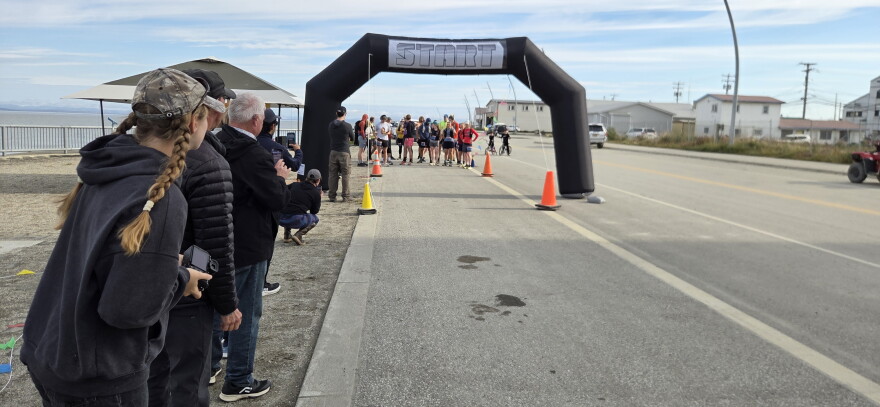 Spectators watch before the start of the Cape Blossom marathon on August 29.