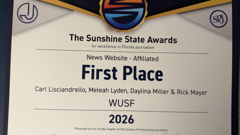A photo of a first place certificate from the Society of Professional Journalists Sunshine State Awards. 