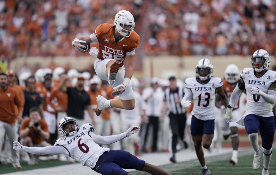Texas tight end Gunnar Helm (85) lea[ps over UTSA safety Elliott Davison (6) during the first half of an NCAA college football game in Austin, Texas, Saturday, Sept. 14, 2024. (AP Photo/Eric Gay)