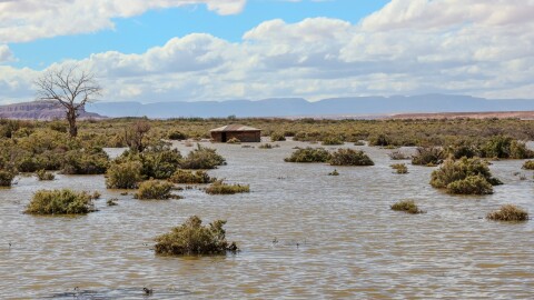 A hogan sits in a flooded area near the Dennehotso community following major flooding between Oct. 10 and 12, 2025 that washed out roads, caused dams and cut off access to homes and farms.