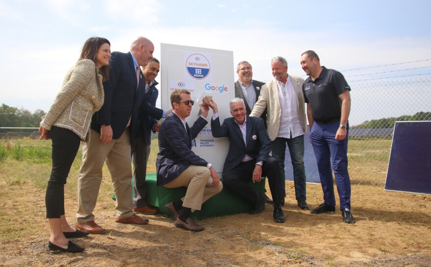 Representatives from different groups involved in the Skyhawk Solar project in northwestern Tennessee ceremoniously "flip the switch" to celebrate the completion and activation of the solar project.