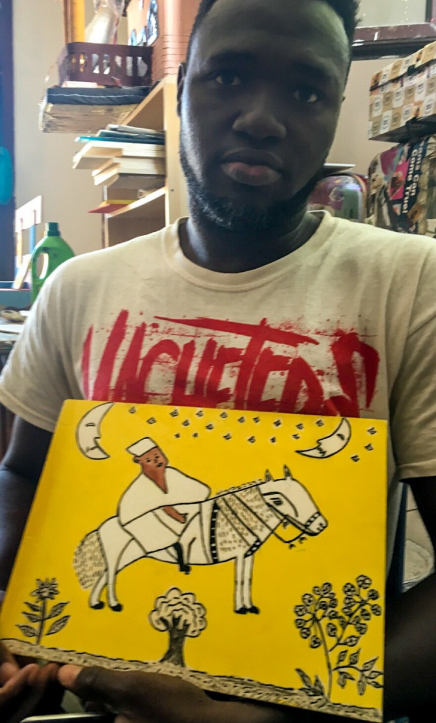 Zacob Camara of Guinea with his Chagall-like depiction of an "African hero."