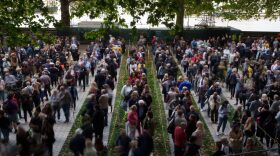 Members of the public wait in line to pay their respects to Queen Elizabeth II as she lays in state within Westminster Hall in London, England.