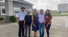 Lay and Khushi with their parents and grandmother outside the hotel their parents own.