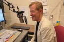 Golden Apple Foundation President Alan Mather speaking into a microphone in the WSIU Studio