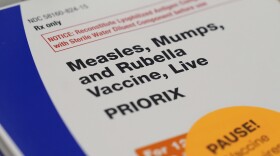 A box containing doses of the measles, mumps, and rubella vaccine (MMR) are displayed at a CVS Pharmacy, Tuesday, Sept. 9, 2025, in Miami. (AP Photo/Rebecca Blackwell)