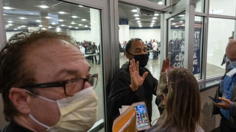 Supporters of President Trump try to enter a room where Michigan absentee ballots are being counted Wednesday at TCF Center in Detroit.
