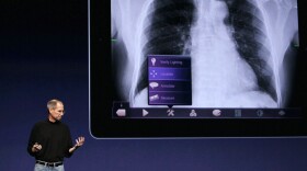Apple CEO Steve Jobs describes the company's new iPad 2 on stage at the Yerba Buena Center for the Arts in San Francisco.