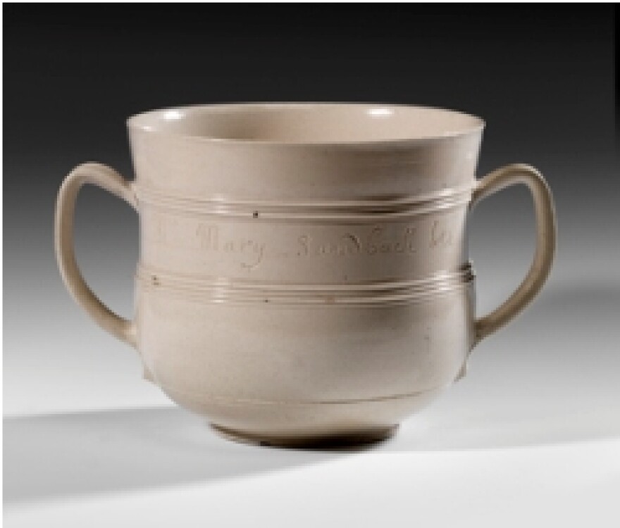 An important cup in the Burnap Collection: a salt-glazed stoneware vessel for caudle, a wine, milks, and spice drink. It's the earliest-known dated piece of English salt-glazed stoneware.