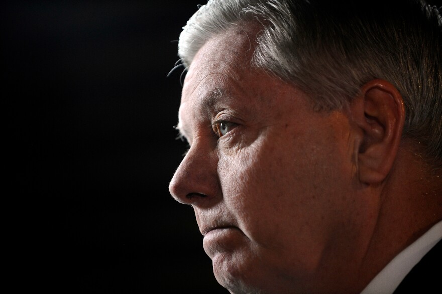 FILE - Sen Lindsey Graham, R-S.C., speaks to the media before the CBS News Republican presidential debate at the Peace Center, Saturday, Feb. 13, 2016, in Greenville, S.C. (AP Photo/Rainier Ehrhardt, File)