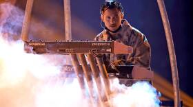 Tainy rehearses onstage for the 2021 American Music Awards at Microsoft Theater on Nov. 19, 2021 in Los Angeles, California. (Frazer Harrison/Getty Images for MRC)