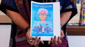 Angelique Roche holds a printout of her upcoming Book "First Freedom: The Story of Opal Lee and Juneteenth," at the Ashe Cultural Arts Center, Thursday, Jan. 29, 2026, in New Orleans. (AP Photo/Gerald Herbert)