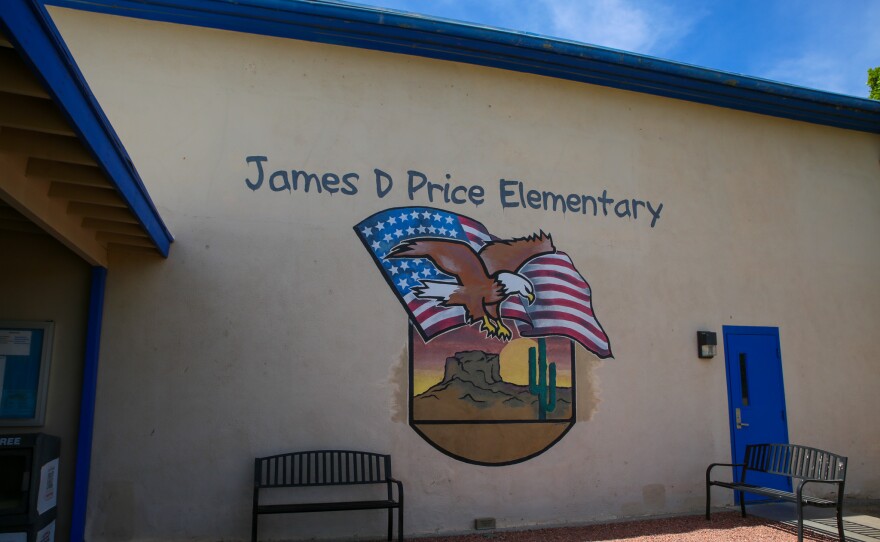 James D. Price Elementary's current facility features an American flag and a bald eagle with a desert backdrop, a reference to the school's YPG location.
