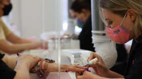 Max Schulte/WXXI News. Chelsea Elizabeth paints nails at Pure Soul Nails where they only only uses low toxic products and have instaled a venting units to filter the air in the shop at every station.