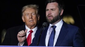 Ohio Senate candidate JD Vance speaks as former President Donald Trump listens at a campaign rally at Wright Bros. Aero Inc. at Dayton International Airport on Monday, Nov. 7, 2022, in Vandalia, Ohio.