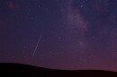 A meteor streaks across the sky during the Perseid meteor shower 
