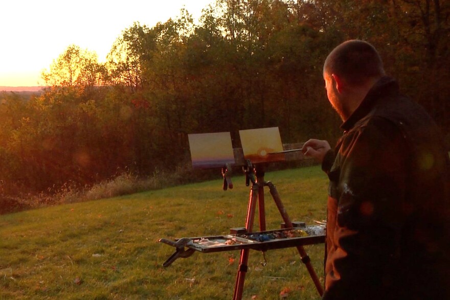Painter Justin Vining works at his portable studio at Brown County State Park.