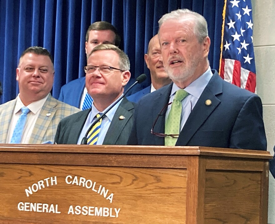 North Carolina Senate leader Phil Berger, R-Rockingham, right, speaks about a budget agreement reached with House Speaker Tim Moore, R-Cleveland, center, at a Legislative Building news conference in Raleigh, N.C. on Tuesday, June 28, 2022.