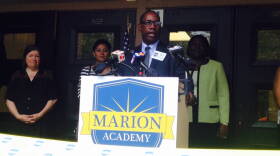 Emmitt Carney, Marion Academy school director, dedicates the new school at the former IPS School #68.
