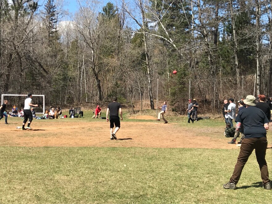 People playing kickball