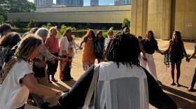 The plaintiffs — six midwives and three mothers — form a circle with their supporters to chant a pule, or prayer, before heading into court. (June 10, 2024)