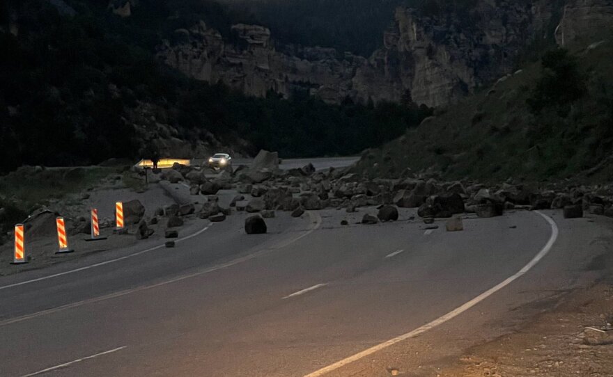  A rockslide in Cedar Canyon with rocks and boulders scattered across the road.