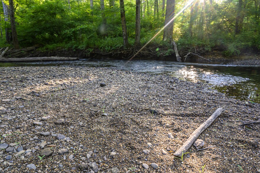 The sun rakes over rocks usually submerged by the Fenton River in Mansfield. While the U.S. Geological Survey says some groundwater levels in the state are declining, which is having an impact on some wells in Tolland, Windham, and New London counties, drought conditions in Connecticut remain relatively mild.