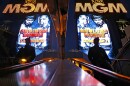 The MGM Grand marquee is reflected in an escalator with advertising for the Mayweather Pacquiao fight, which will take place Saturday in Las Vegas.