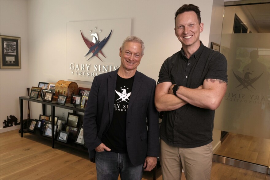 Gary Sinise, left, and CreatiVets executive director Richard Casper, right, pose for a photo in the Gary Sinise Foundation offices on Thursday, Sept. 10, 2025, in Franklin, Tenn.