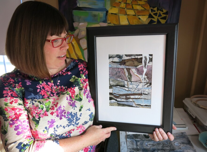 Rodgers with artwork inspired by her father's struggle with sepsis.