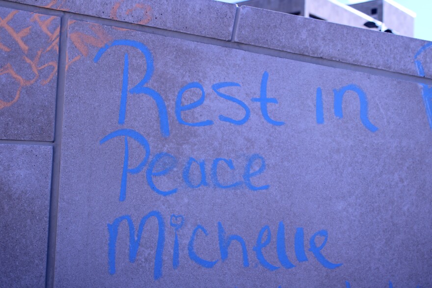 A tribute to Michelle Woolford chalked on a wall outside the Broome County government building along Halsey Street in Binghamton. Woolford died in her first floor room at the Knights Inn in Endwell.