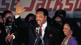 FILE - Jesse Jackson, with his wife Jacqueline, concedes defeat in the Illinois Democratic primary on March 16, 1988, in Chicago. (AP Photo/Lisa Genesen, File)