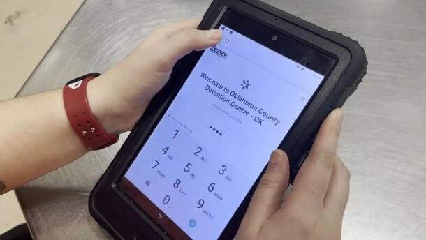 An Oklahoma County Detention Center detainee uses a tablet to send messages and video visits.