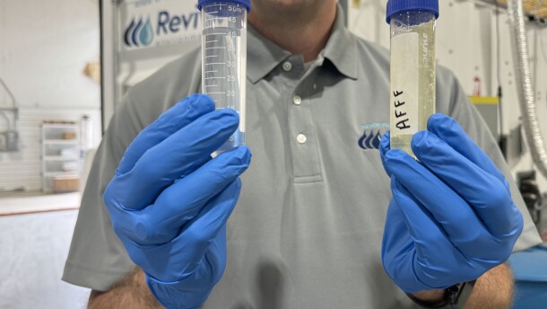 Revive Environmental CEO David Trueba holding samples of AFFF (pictured right) and the result after processing the the PFAS annihilator (pictured left): water.