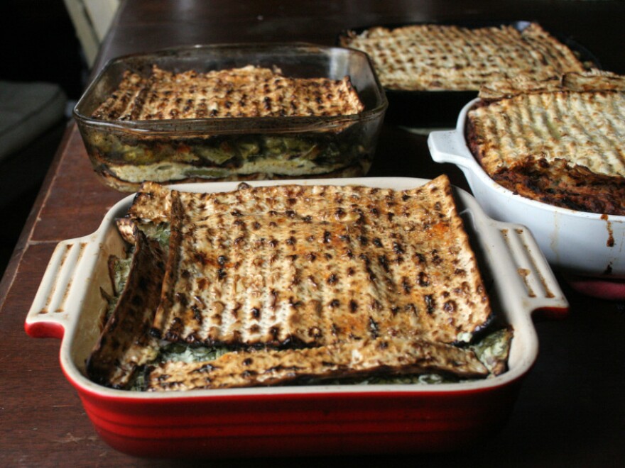 Layered matzo pies, or minas, await slicing. The top layer of matzo is glazed with a beaten egg, to give the finished dish a burnished shine.
