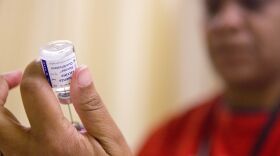 A nurse prepares a flu shot from a vaccine vial at the Salvation Army in Atlanta. (Credit: David Goldman / AP Photo)